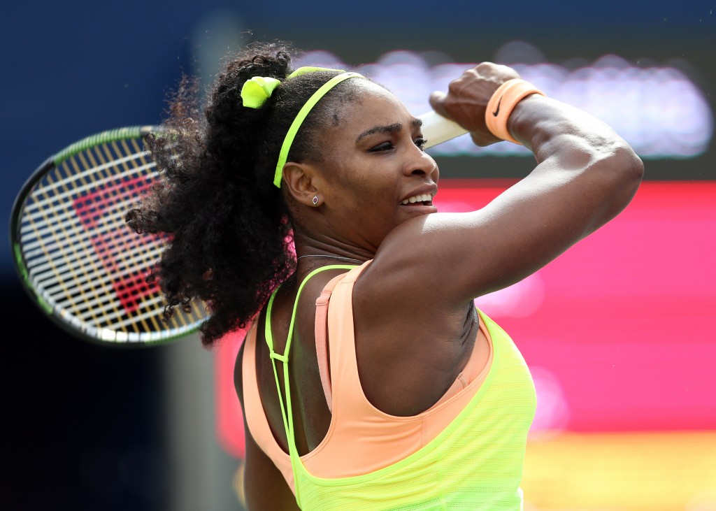 TORONTO, ON - AUGUST 11: Serena Williams of the USA plays a shot against Flavia Pennetta of Italy during Day 2 of the Rogers Cup at the Aviva Centre on August 11, 2015 in Toronto, Ontario, Canada.   Vaughn Ridley/Getty Images/AFP