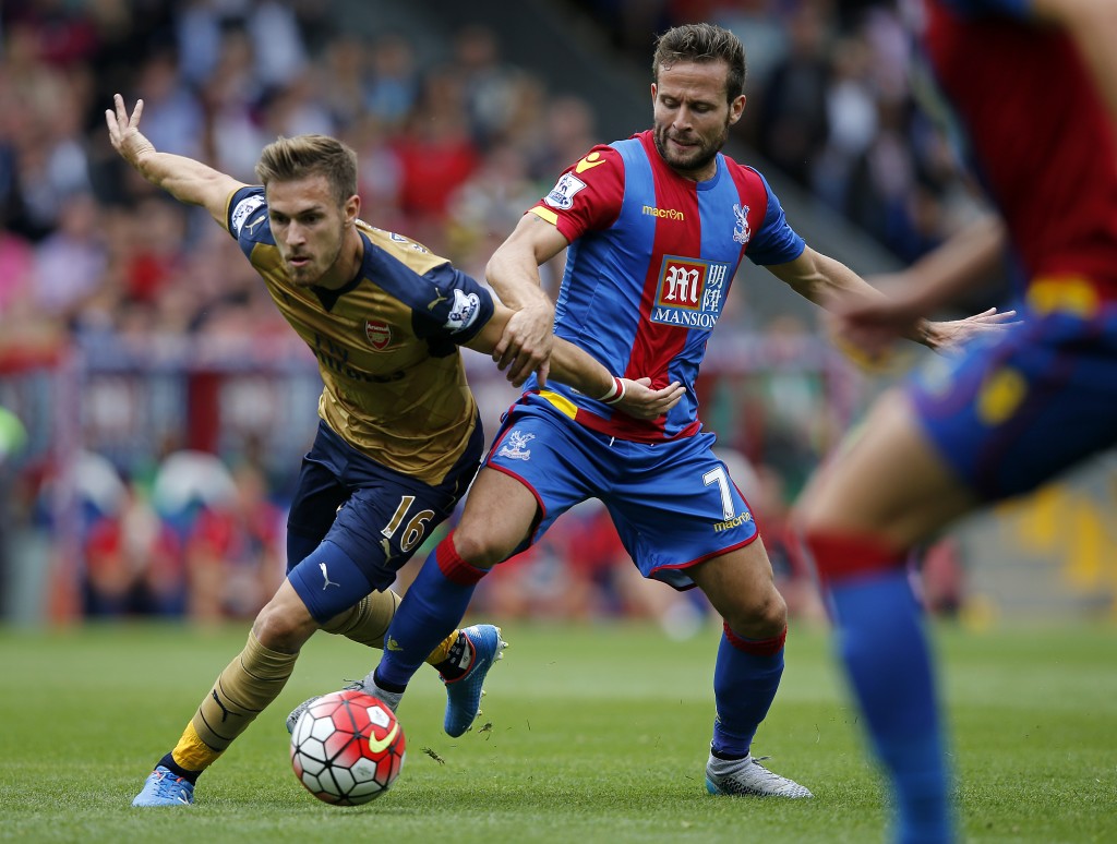 Crystal Palace's French midfielder Yohan Cabaye (R) vies with Arsenal's Welsh midfielder Aaron Ramsey during of the English Premier League football match between Crystal Palace and Arsenal at Selhurst Park in south London on August 16, 2015. AFP PHOTO / ADRIAN DENNIS RESTRICTED TO EDITORIAL USE. No use with unauthorized audio, video, data, fixture lists, club/league logos or 'live' services. Online in-match use limited to 75 images, no video emulation. No use in betting, games or single club/league/player publications.