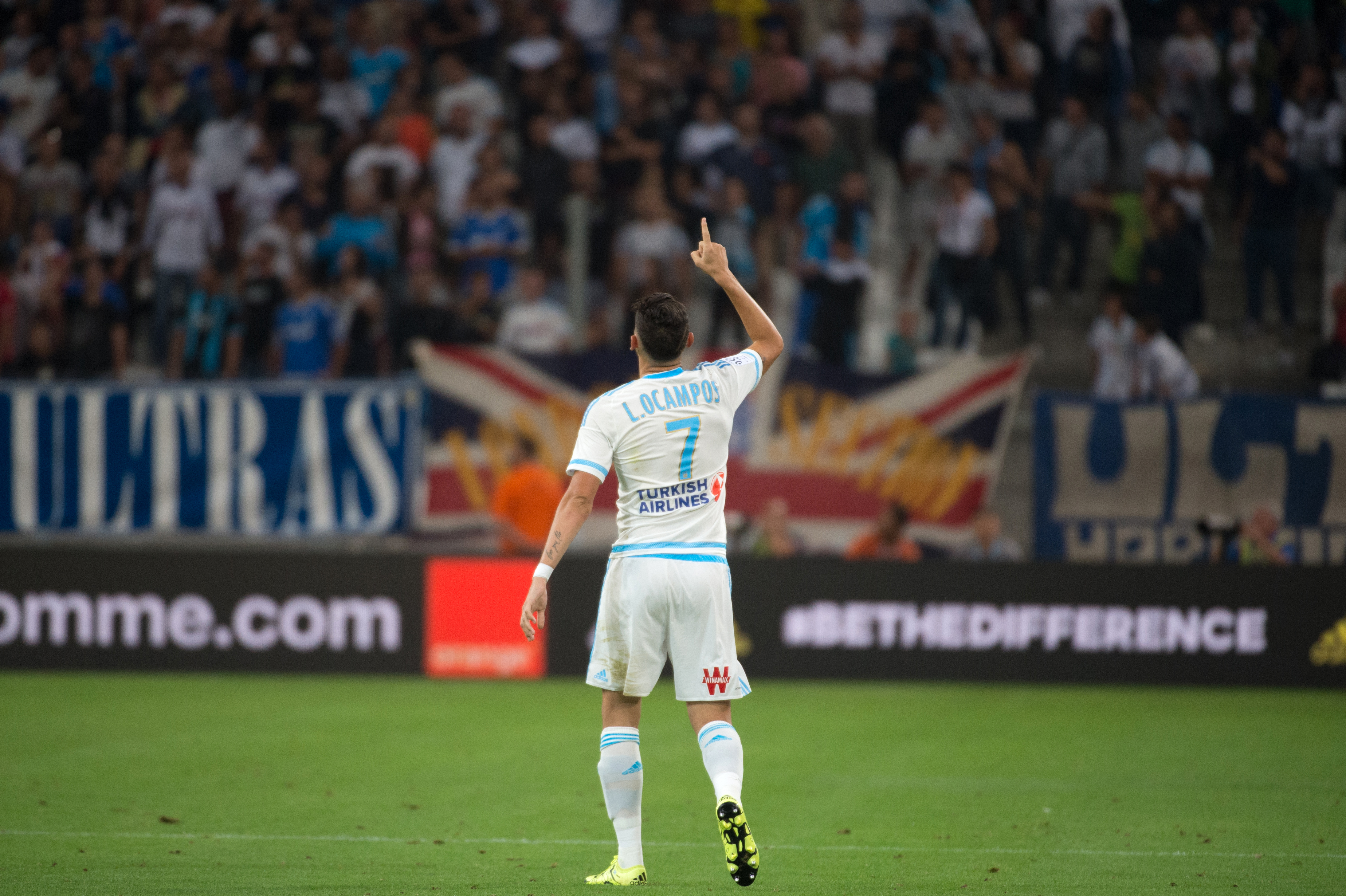 Marseille's Argentinian forward Lucas Ocampos celebrates after scoring a goal during the French L1 football match Olympique de Marseille vs Troyes on August 23, 2015 at the Velodrome stadium in Marseille, southern France. AFP PHOTO / BERTRAND LANGLOIS