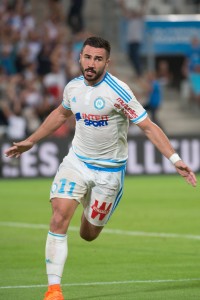 Marseille's French midfielder Romain Alessandrini celebrates after scoring a goal during the French L1 football match Olympique de Marseille vs Troyes on August 23, 2015 at the Velodrome stadium in Marseille, southern France. AFP PHOTO / BERTRAND LANGLOIS