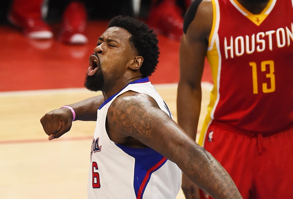 (FILES) This May 10, 2015 file photo shows Los Angeles Clippers DeAndre Jordan as he reacts during NBA playoff Game Four against the Houston Rockets, at Staples Center in Los Angeles, California. The Los Angeles Clipers have been fined $250,000 over an improper offer made to DeAndre Jordan last month as they attempted to re-sign the player, the NBA said August 25, 2015. A statement from the NBA headquarters said the Clippers had violated league rules prohibiting teams from offering players unauthorized business or investment opportunities. It said the violation related to a pitch made by the Clippers to Jordan on July 2 which "improperly included a potential third-party endorsement opportunity for the player."  AFP PHOTO / ROBYN BECK