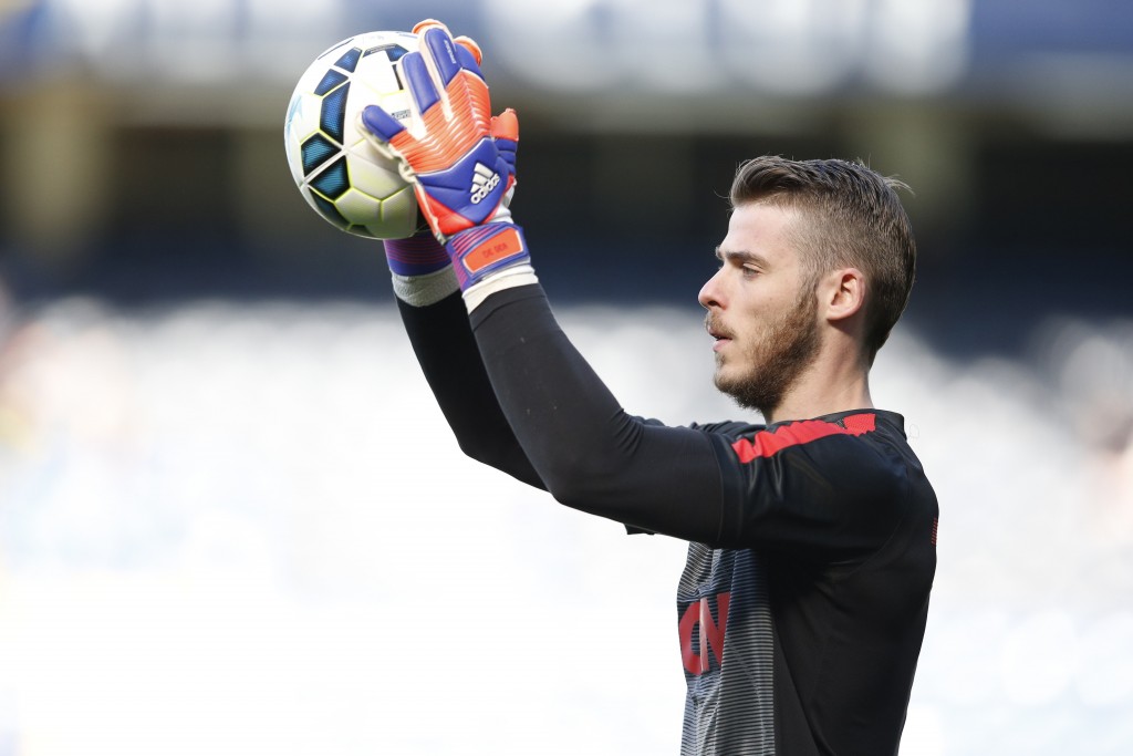 Manchester United's Spanish goalkeeper David de Gea warms up before the English Premier League football match between Chelsea and Manchester United at Stamford Bridge in London on April 18, 2015. AFP PHOTO / ADRIAN DENNIS RESTRICTED TO EDITORIAL USE. No use with unauthorized audio, video, data, fixture lists, club/league logos or live services. Online in-match use limited to 45 images, no video emulation. No use in betting, games or single club/league/player publications.        (Photo credit should read ADRIAN DENNIS/AFP/Getty Images)