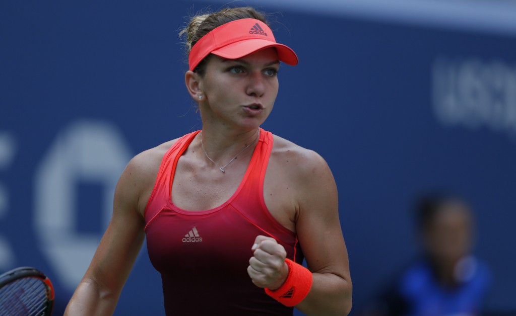 Simona Halep of Romania reacts to a shot against Marina Erakovic of New Zealand during their 2015 US Open Women's Singles round 1 match at the USTA Billie Jean King National Tennis Center September 1, 2015 in New York. Second seed Halep reached the US Open second round on Tuesday when Erakovic retired with a knee injury.   AFP PHOTO/KENA BETANCUR