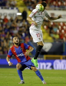 Levante's Algerian forward Nabil Ghilas (L) vies with Sevilla's Italian midfielder Marco Andreolli during the Spanish league football match Levante UD vs Sevilla FC at the Ciutat de Valencia stadium in Valencia on September 11, 2015. AFP PHOTO/ JOSE JORDAN