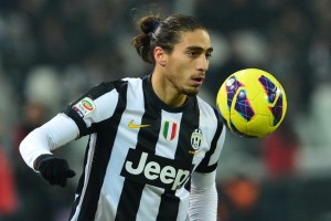 Juventus' Uruguayan defender Martin Caceres eyes the ball during their Seria A football match between Juventus and Genoa at the "Juventus Stadium" in Turin on January 26, 2013. AFP PHOTO / GIUSEPPE CACACE