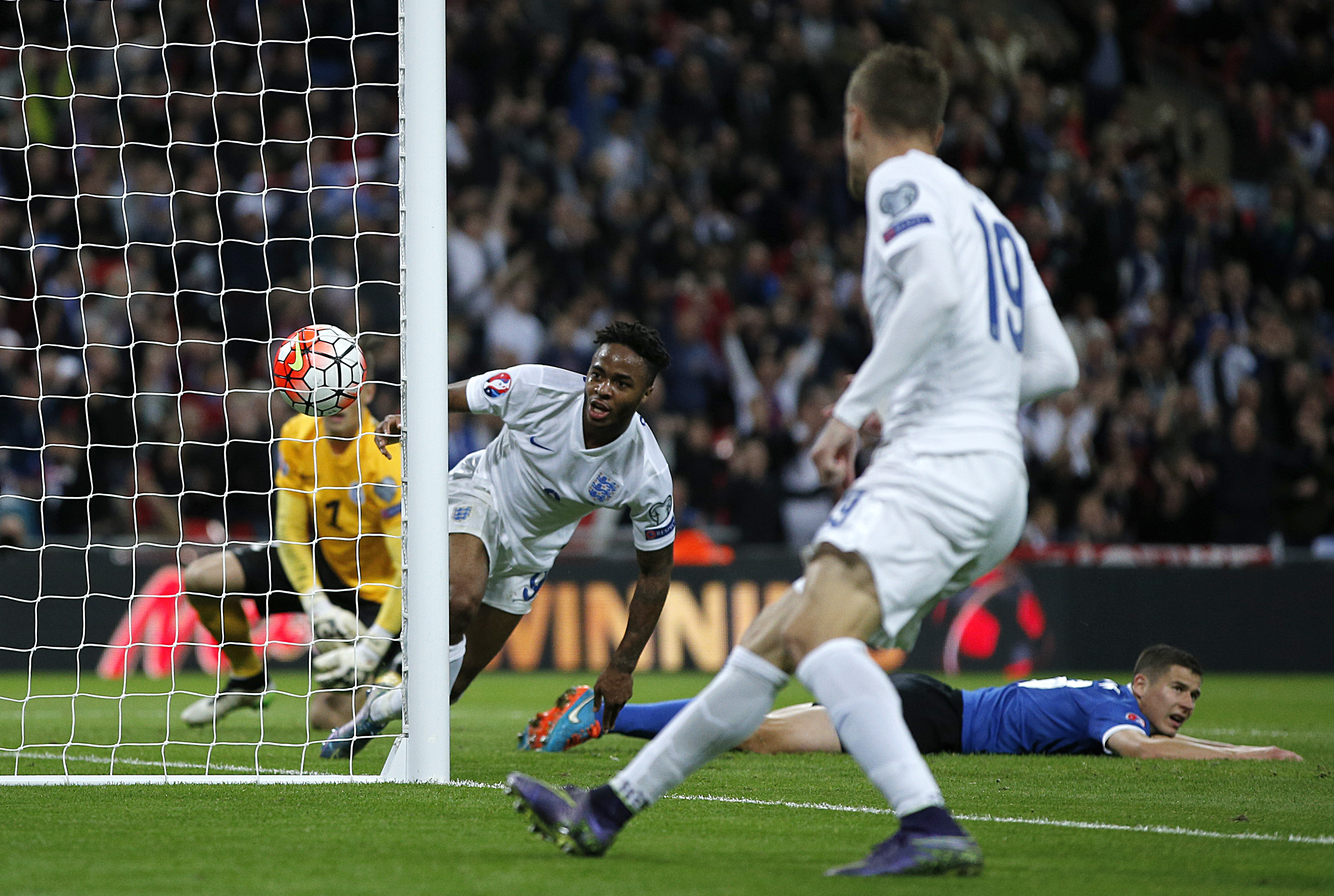England's midfielder Raheem Sterling (2nd L) scores his team's second goal during the Euro 2016 qualifying group E football match between England and Estonia at Wembley Stadium in north London on October 9, 2015. AFP PHOTO / ADRIAN DENNIS NOT FOR MARKETING OR ADVERTISING USE / RESTRICTED TO EDITORIAL USE