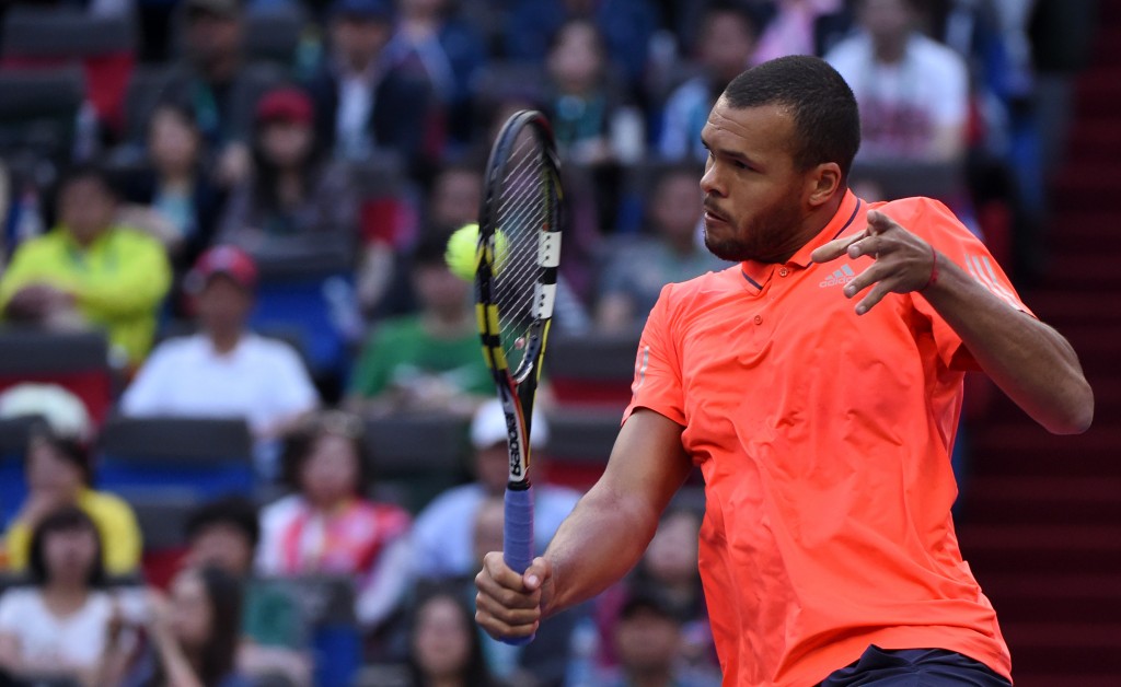 Wilfried Tsonga of France hits a return during his men's singles final match against Novak Djokovic of Serbia at the Shanghai Masters tennis tournament in Shanghai on October 18, 2015. AFP PHOTO / JOHANNES EISELE