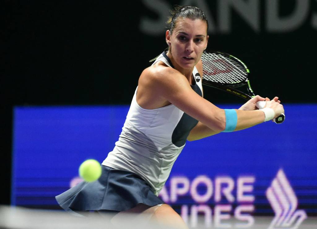 Após um tropeço na estreia do WTA Finals, Pennetta venceu Radwanska (foto: Roslan Dahman/AFP)