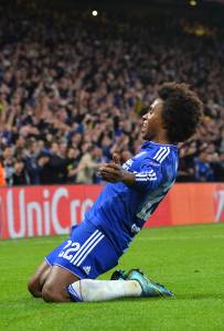 Chelsea's Brazilian midfielder Willian celebrates after scoring from a free kick during a UEFA Chamions league group stage football match between Chelsea and Dynamo Kiev at Stamford Bridge stadium in west London on November 4, 2015. AFP PHOTO / GLYN KIRK