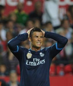 Real Madrid's Portuguese forward Cristiano Ronaldo reacts during the Spanish league football match Sevilla FC vs Real Madrid CF at the Ramon Sanchez Pizjuan stadium in Sevilla on November 8, 2015. AFP PHOTO/ CRISTINA QUICLER