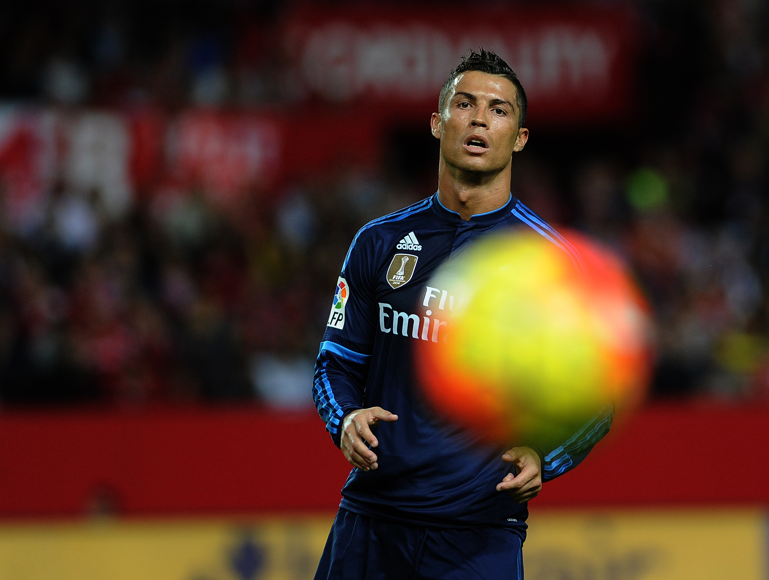 Real Madrid's Portuguese forward Cristiano Ronaldo eyes the ball during the Spanish league football match Sevilla FC vs Real Madrid CF at the Ramon Sanchez Pizjuan stadium in Sevilla on November 8, 2015. AFP PHOTO/ CRISTINA QUICLER