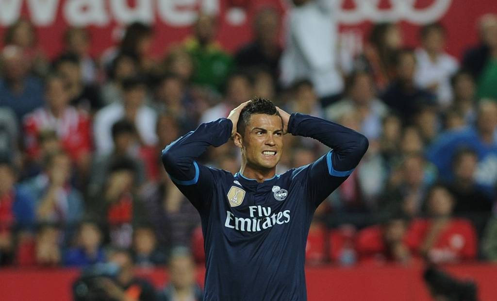 Real Madrid's Portuguese forward Cristiano Ronaldo reacts during the Spanish league football match Sevilla FC vs Real Madrid CF at the Ramon Sanchez Pizjuan stadium in Sevilla on November 8, 2015. AFP PHOTO/ CRISTINA QUICLER