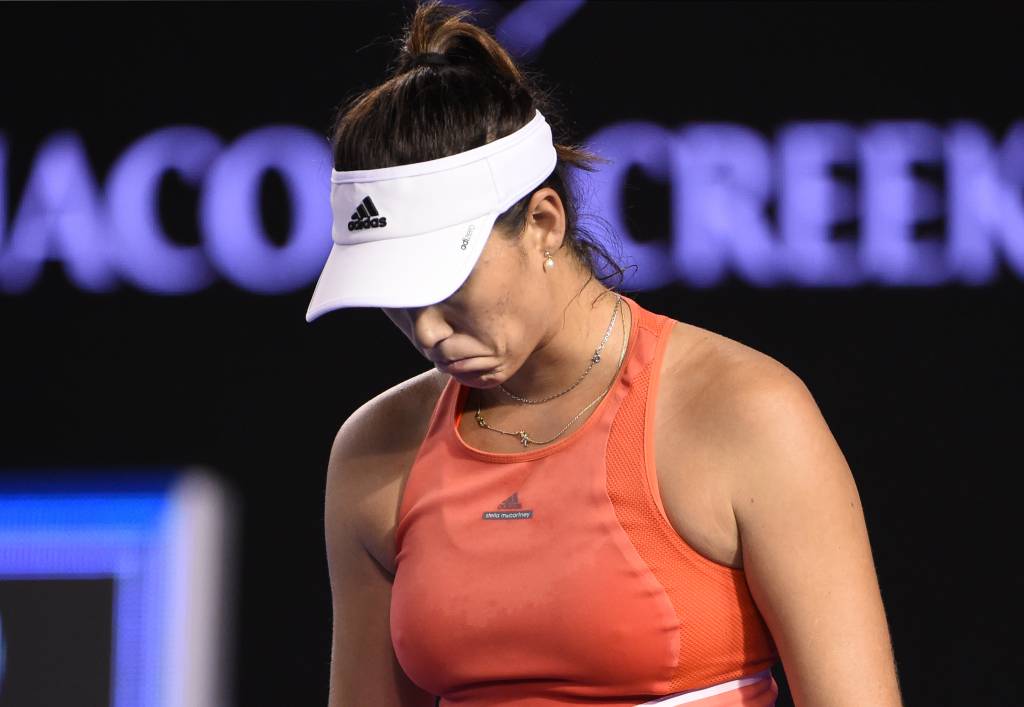 Spain's Garbine Muguruza walks on court during her women's singles match against Czech Republic's Barbora Strycova on day six of the 2016 Australian Open tennis tournament in Melbourne on January 23, 2016. AFP PHOTO / WILLIAM WEST-- IMAGE RESTRICTED TO EDITORIAL USE - STRICTLY NO COMMERCIAL USE / AFP / WILLIAM WEST