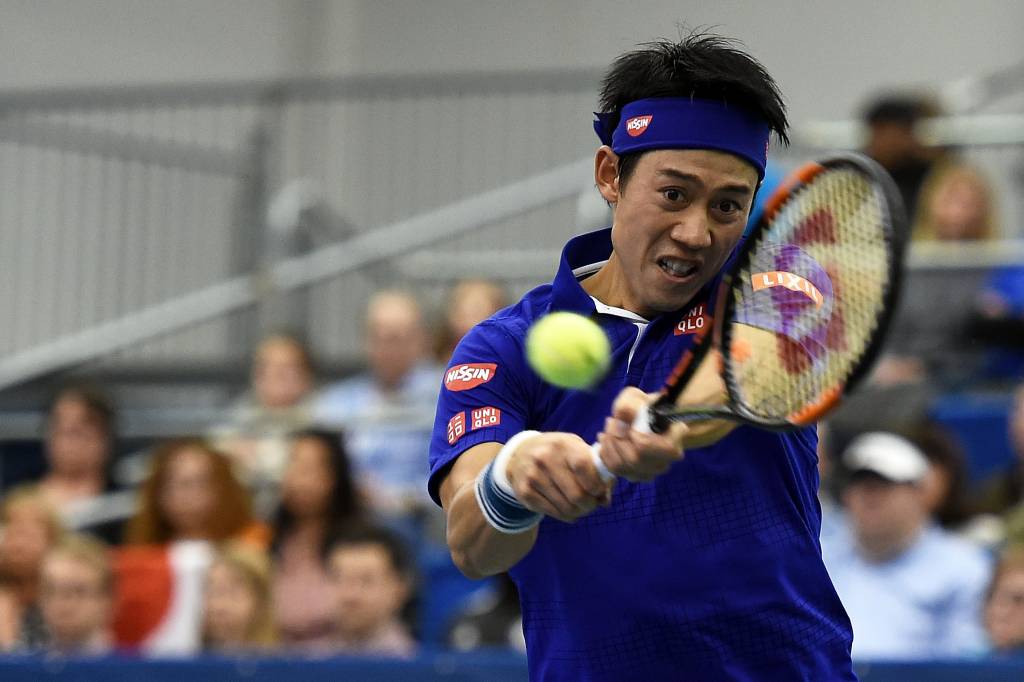 MEMPHIS, TN - FEBRUARY 13: Kei Nishikori of Japan returns a shot to Sam Querrey of the United States during their semi-final singles match on Day 6 of the Memphis Open at the Racquet Club of Memphis on February 13, 2016 in Memphis, Tennessee. Stacy Revere/Getty Images/AFP