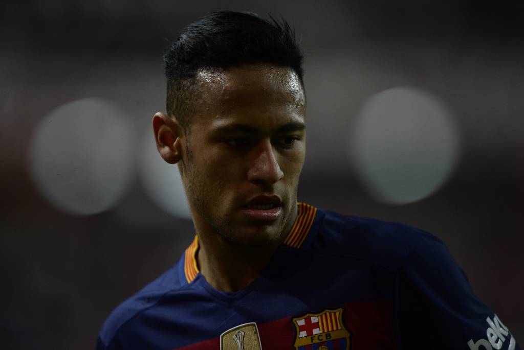 Barcelona's Brazilian forward Neymar looks on during the Spanish league football match Real Sporting de Gijon vs FC Barcelona at El Molinon stadium in Gijon, on February 17, 2016. Barcelona won the match 3-1. AFP PHOTO / MIGUEL RIOPA / AFP / MIGUEL RIOPA