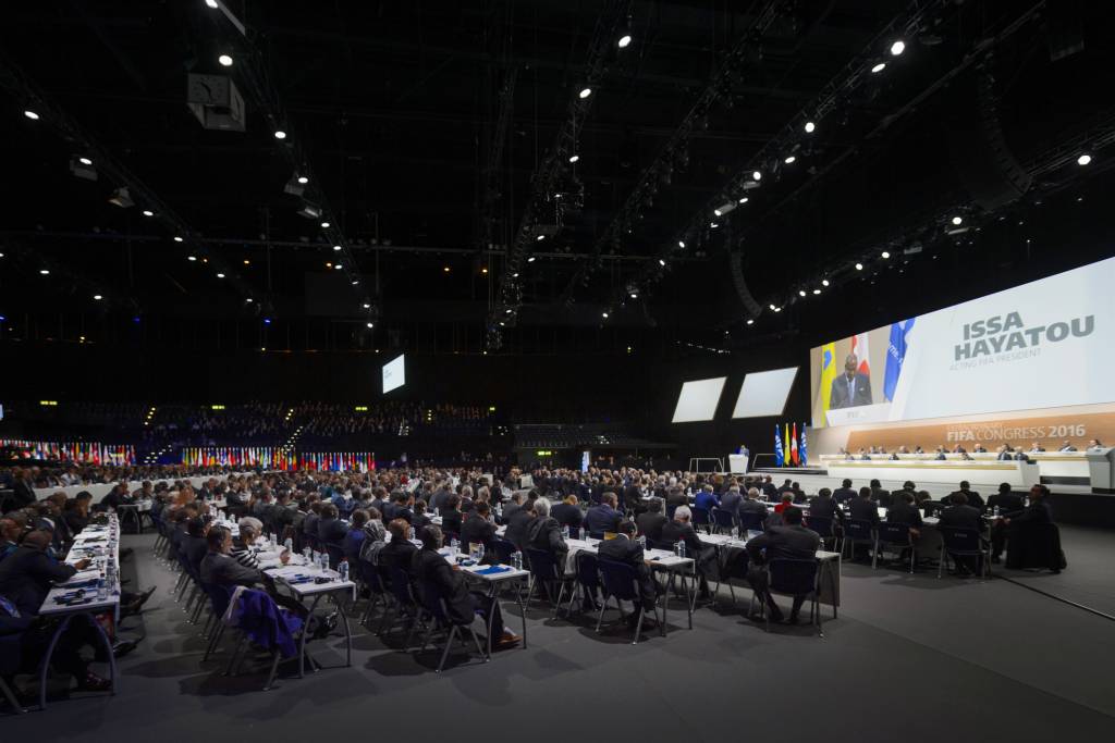 Delegates listen to FIFA acting president Issa Hayatou during the FIFA Electoral Congress on February 26, 2016 in Zurich. FIFA members will elect a new president and pass reforms they hope will open an escape route from a storm of scandal symbolised by the downfall of veteran leader Sepp Blatter. / AFP / FABRICE COFFRINI