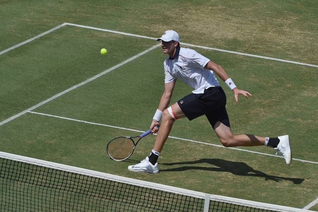 Isner foi importante na classificação dos Estados Unidos vencendo seus dois jogos de simples (Foto: Paul Crock/AFP)