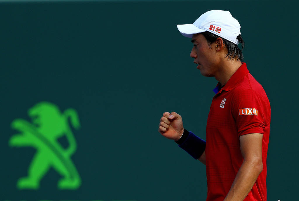 Em jogo pegado, Nishikori venceu Gael Monfils (Foto: Mike Ehrmann/AFP)