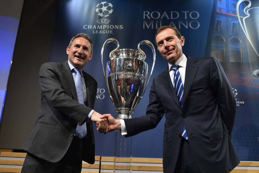 Real Madrid director of institutional relations Emilio Butragueno (R) shakes hands with Manchester City football director Txiki Begiristain after the semi-final draw for the UEFA Champions League at the UEFA headquarters in Nyon on April 15, 2016. AFP PHOTO / FABRICE COFFRINI / AFP PHOTO / FABRICE COFFRINI