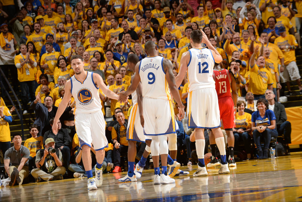 OAKLAND, CA - APRIL 18: Klay Thompson #11 of the Golden State Warriors shakes hands with Andre Iguodala #9 of the Golden State Warriors during the game against the Houston Rockets in Game Two of the Western Conference Quarterfinals during the 2016 NBA Playoffs on April 18, 2016 at ORACLE Arena in Oakland, California. NOTE TO USER: User expressly acknowledges and agrees that, by downloading and or using this photograph, user is consenting to the terms and conditions of Getty Images License Agreement. Mandatory Copyright Notice: Copyright 2016 NBAE   Noah Graham/NBAE via Getty Images/AFP