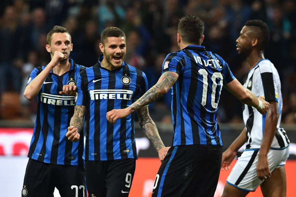 Inter Milan's midfielder from Montenegro Stevan Jovetic (R) celebrates after scoring a goal with Inter Milan's forward from Argentina Mauro Icardi and Inter Milan's midfielder from Croatia Marcelo Brozovic (L) during the Italian Serie A football match Inter Milan vs Udinese at the "San Siro" Stadium in Milan on April 23, 2016. / AFP PHOTO / GIUSEPPE CACACE