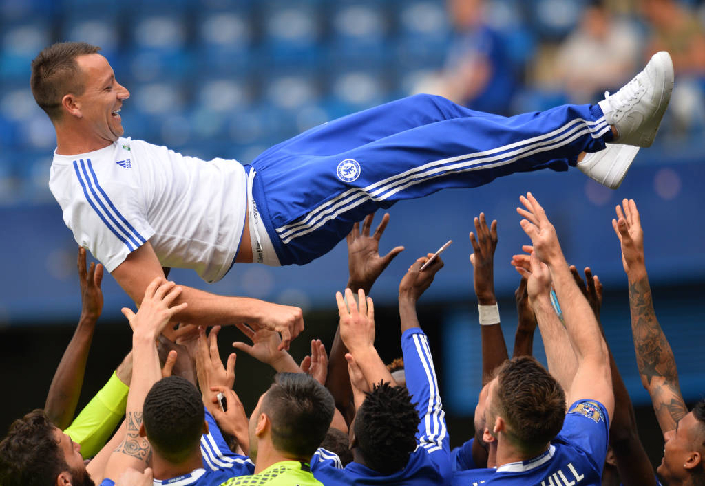 Chelsea's English defender John Terry (C) is thrown in the air by teammates after the English Premier League football match between Chelsea and Leicester City at Stamford Bridge in London on May 15, 2016. / AFP PHOTO / GLYN KIRK / RESTRICTED TO EDITORIAL USE. No use with unauthorized audio, video, data, fixture lists, club/league logos or 'live' services. Online in-match use limited to 75 images, no video emulation. No use in betting, games or single club/league/player publications. /