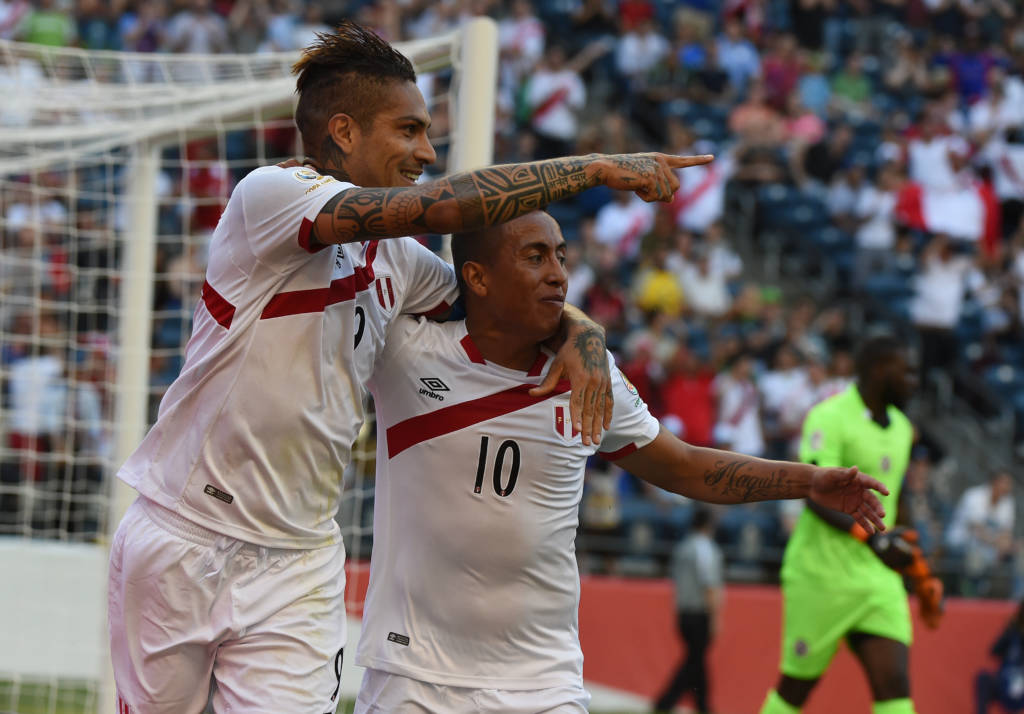 Peru's Paolo Guerrero (L) celebrates with Christian Cueva after scoring against Haiti during the Copa America Centenario football tournament in Seattle, Washington, United States, on June 4, 2016. / AFP PHOTO / Mark RALSTON