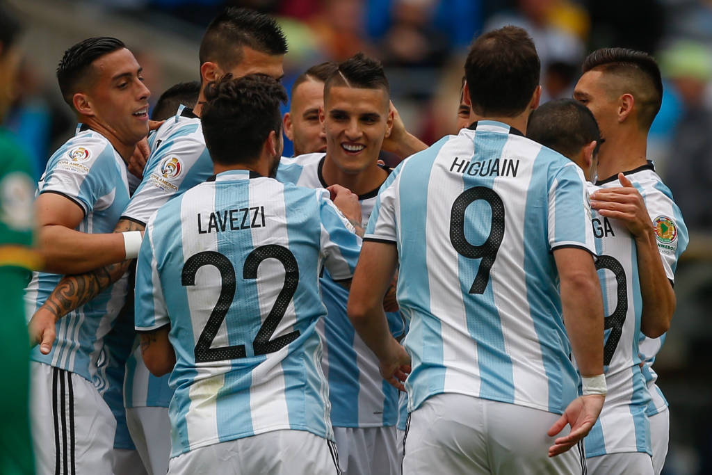 SEATTLE, WA - JUNE 14: Erik Lamela #18 (center facing camera) of Argentina celebrates with teammates after scoring a goal against Bolivia during the 2016 Copa America Centenario Group D match at CenturyLink Field on June 14, 2016 in Seattle, Washington.   Otto Greule Jr/Getty Images/AFP
