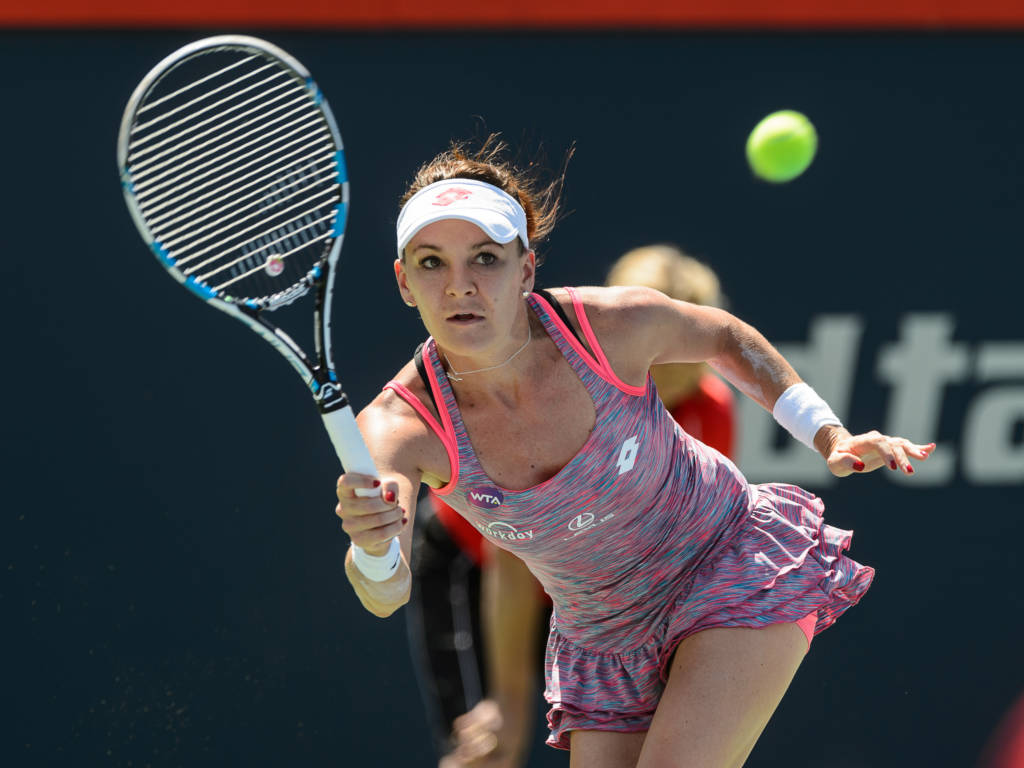 MONTREAL, ON - JULY 27: Agnieszka Radwanska of Poland returns the ball against Monica Niculescu of Romania during day three of the Rogers Cup at Uniprix Stadium on July 27, 2016 in Montreal, Quebec, Canada.   Minas Panagiotakis/Getty Images/AFP