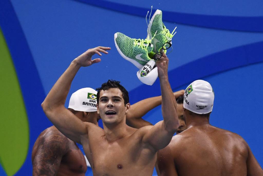 Brazil's Marcelo Chierighini reacts after taking part in the Men's 4x100m Freestyle Relay heats during the swimming event at the Rio 2016 Olympic Games at the Olympic Aquatics Stadium in Rio de Janeiro on August 7, 2016. / AFP PHOTO / CHRISTOPHE SIMON