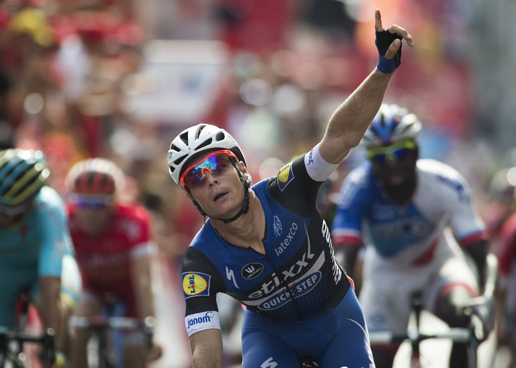 Etixx-Quickstep' Begium cyclist Gianni Meersman celebrates winning as he crosses the finish line during the fifth stage of the 71st edition of "La Vuelta" Tour of Spain, a 171.3 km route between Viveiro and Lugo, on August 23, 2016. / AFP PHOTO / JAIME REINA