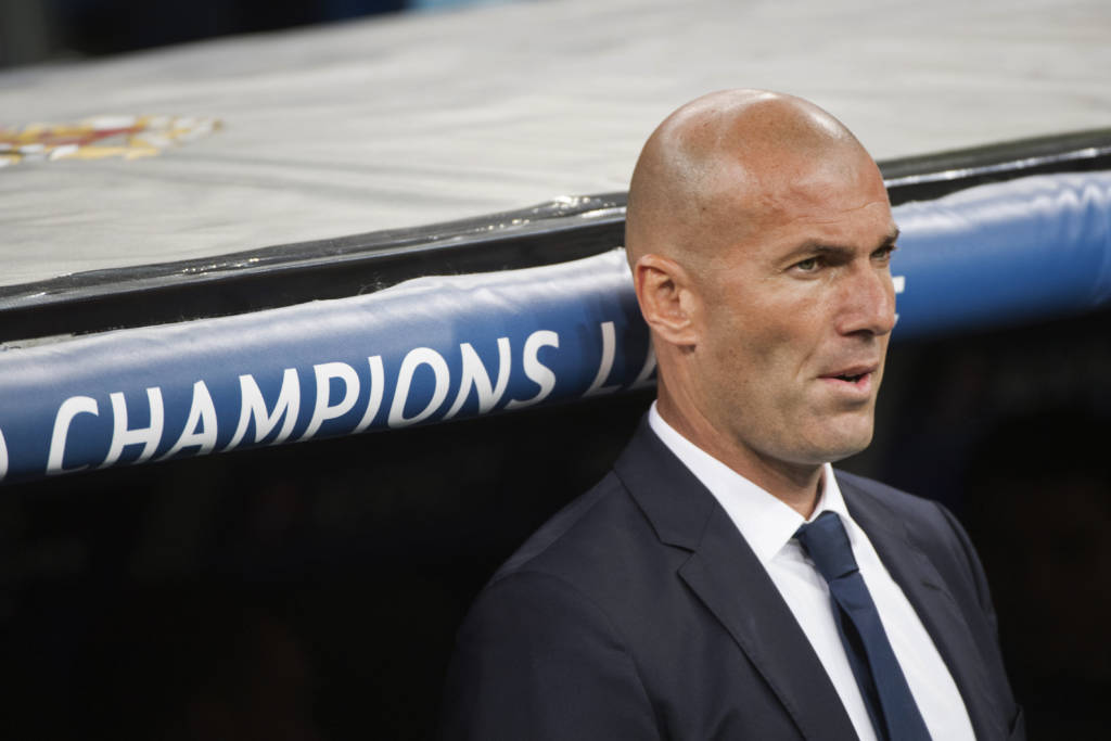 Real Madrid's French coach Zinedine Zidane looks on before the UEFA Champions League football match Real Madrid CF vs Sporting CP at the Santiago Bernabeu stadium in Madrid on September 14, 2016. / AFP PHOTO / CURTO DE LA TORRE