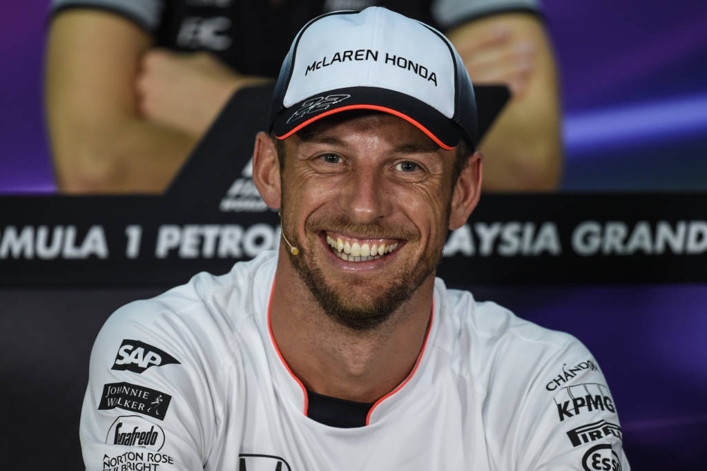 McLaren Honda's British driver Jenson Button smiles during a press conference ahead of the first free practice session of the Formula One Malaysia Grand Prix in Sepang on September 29, 2016. / AFP PHOTO / MOHD RASFAN