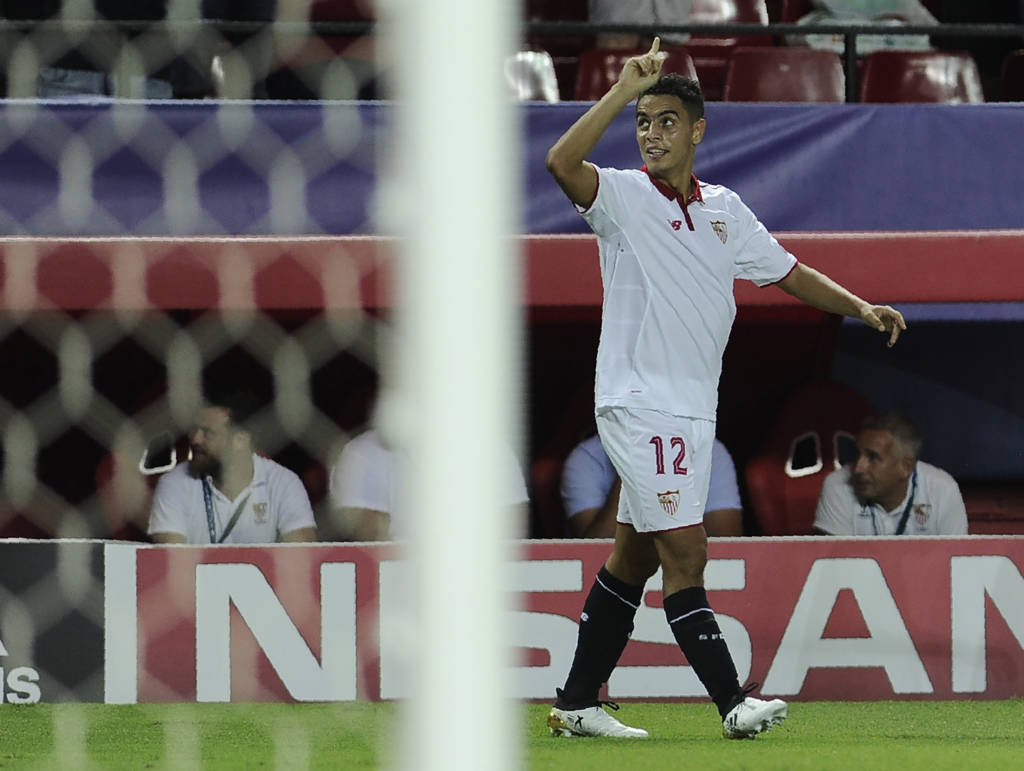 Sevilla's French forward Wissam Ben Yedder celebrates after scoring a goal during the UEFA Champions League Group H football match Sevilla FC vs Olympique Lyonnais at the Ramon Sanchez Pizjuan stadium in Sevilla on September 27, 2016. / AFP PHOTO / CRISTINA QUICLER