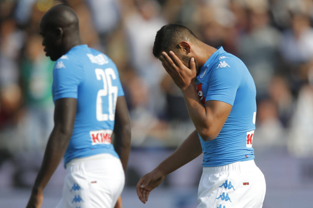 Napoli's defender from Algeria Faouzi Ghoulam (R) reacts during the Italian Serie A football match Atalanta vs Napoli on October 2, 2016 in Bergamo. / AFP PHOTO / Marco BERTORELLO