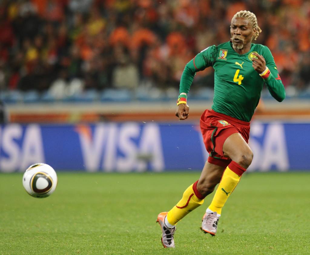 (FILES) This file photo taken on June 24, 2010 shows Cameroon's defender Rigobert Song eyeing the ball during the Group E first round 2010 World Cup football match against Cameroon on June 24, 2010 at Green Point stadium in Cape Town. Cameroon's coach Rigobert Song, 40, suffered a stroke in Yaounde on October 2, 2016 and is in a coma, reported the Cameroon Radio television (CRTV). / AFP PHOTO / CARL DE SOUZA