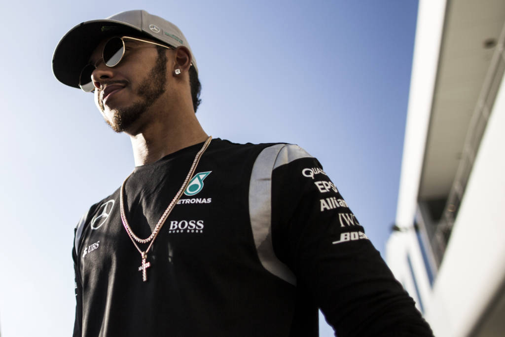 Mercedes driver Lewis Hamilton of Britain looks on after talking to the media during the Formula One Japanese Grand Prix in Suzuka on October 6, 2016. / AFP PHOTO / BEHROUZ MEHRI