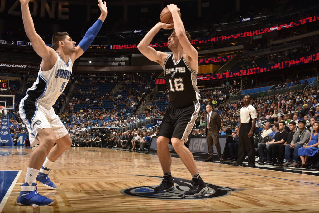 ORLANDO, FL - ORLANDO 12: Pau Gasol #16 of the San Antonio Spurs shoots the ball against the Orlando Magic on October 12, 2016 at the Amway Center in Orlando, Florida. NOTE TO USER: User expressly acknowledges and agrees that, by downloading and or using this Photograph, user is consenting to the terms and conditions of the Getty Images License Agreement. Mandatory Copyright Notice: Copyright 2016 NBAE   Fernando Medina/NBAE via Getty Images/AFP