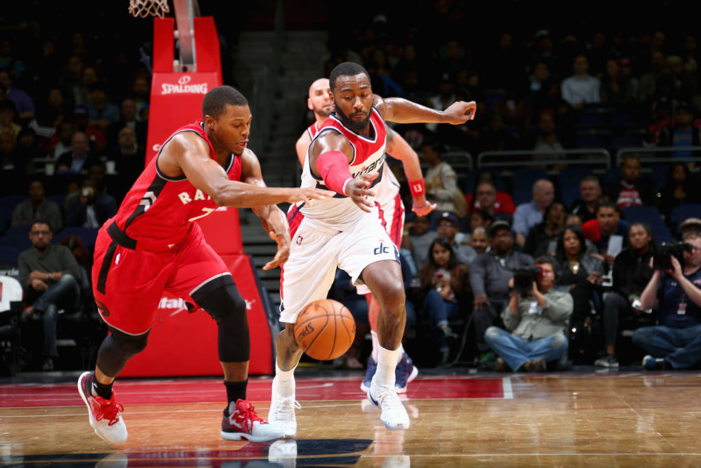 WASHINGTON, DC -  OCTOBER 21: John Wall #2 of the Washington Wizards steals the ball from Kyle Lowry #7 of the Toronto Raptors during a preseason game on October 21, 2016 at Verizon Center in Washington, DC. NOTE TO USER: User expressly acknowledges and agrees that, by downloading and or using this Photograph, user is consenting to the terms and conditions of the Getty Images License Agreement. Mandatory Copyright Notice: Copyright 2016 NBAE Ned Dishman/NBAE via Getty Images/AFP