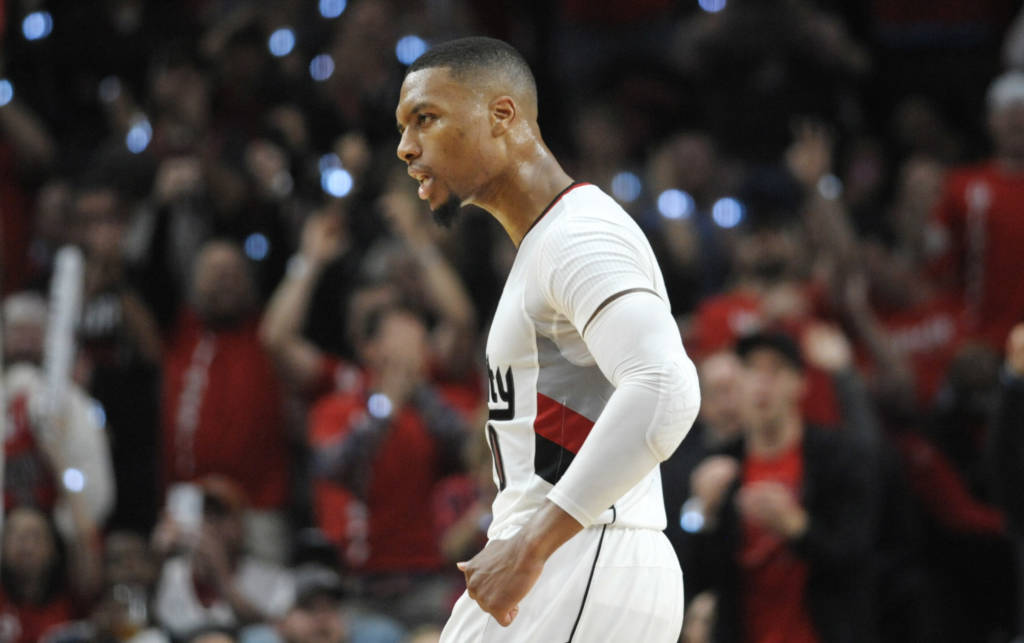 PORTLAND, OR - SEPTEMBER 25: Damian Lillard #0 of the Portland Trail Blazers celebrates after hitting a three point shot late in the fourth quarter of an NBA game against the Utah Jazzat the Moda Center on September 25, 2016 in Portland, Oregon. Lillard scored 39 points as the Blazers won 113-104. NOTE TO USER: User expressly acknowledges and agrees that by downloading and/or using this photograph, user is consenting to the terms and conditions of the Getty Images License Agreement. Steve Dykes/Getty Images/AFP