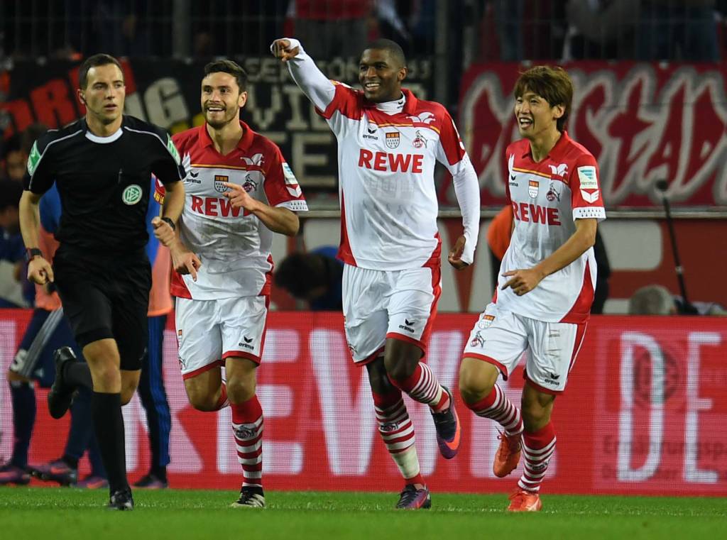 Cologne's French striker Anthony Modeste (C) and his teammates celebrate during the German first division Bundesliga football match between 1 FC Cologne and Hamburger SV in Cologne, western Germany, on October 30, 2016. / AFP PHOTO / PATRIK STOLLARZ / RESTRICTIONS: DURING MATCH TIME: DFL RULES TO LIMIT THE ONLINE USAGE TO 15 PICTURES PER MATCH AND FORBID IMAGE SEQUENCES TO SIMULATE VIDEO. == RESTRICTED TO EDITORIAL USE == FOR FURTHER QUERIES PLEASE CONTACT DFL DIRECTLY AT + 49 69 650050