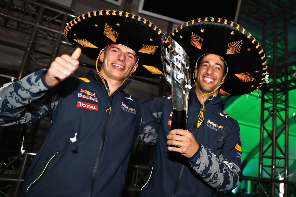 MEXICO CITY, MEXICO - OCTOBER 30: Daniel Ricciardo of Australia and Red Bull Racing celebrates getting third position with Max Verstappen of Netherlands and Red Bull Racing after Sebastian Vettel of Germany and Ferrari was given a 10 second penalty following a stewards enquiry during the Formula One Grand Prix of Mexico at Autodromo Hermanos Rodriguez on October 30, 2016 in Mexico City, Mexico. Mark Thompson/Getty Images/AFP