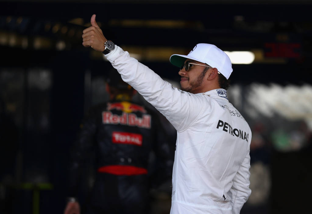 MEXICO CITY, MEXICO - OCTOBER 29: Lewis Hamilton of Great Britain and Mercedes GP waves to the crowd in parc ferme after qualifying in pole position during qualifying for the Formula One Grand Prix of Mexico at Autodromo Hermanos Rodriguez on October 29, 2016 in Mexico City, Mexico. Clive Mason/Getty Images/AFP