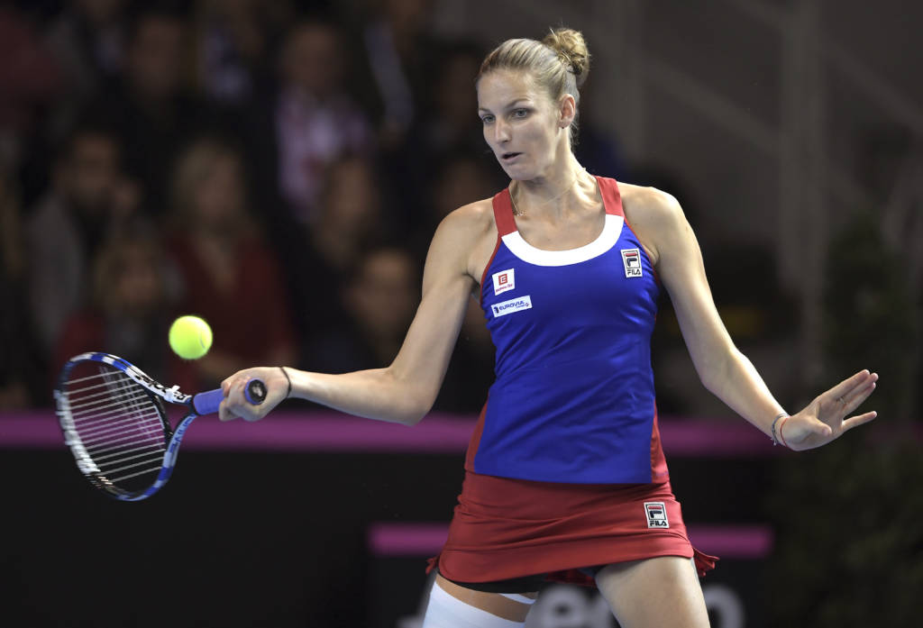 Czech Republic's Karolina Pliskova returns a ball to France's Kristina Mladenovic, on November 12, 2016 in Strasbourg, eastern France, during their Fed Cup final tennis match between France and Czech Republic. / AFP PHOTO / PATRICK HERTZOG