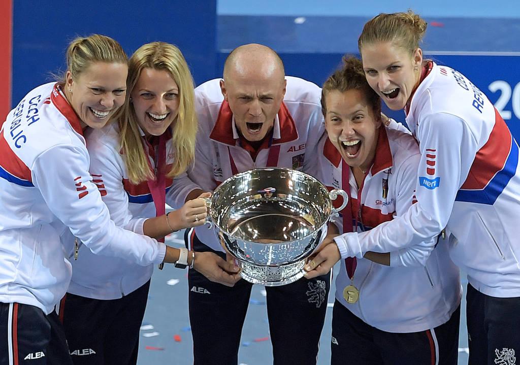 Czech Republic's players pose with the trophy at the end of the Fed Cup final between France and the Czech Republic in Strasbourg, eastern France, on November 13, 2016. / AFP PHOTO / PATRICK HERTZOG