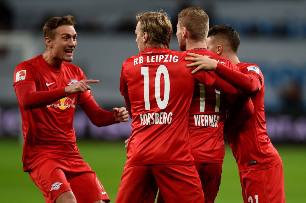 Leipzig´s players celebrate scoring during the German first division Bundesliga football match of Bayer Leverkusen vs RB Leipzig in Leverkusen, western Germany, on November 18, 2016. / AFP PHOTO / PATRIK STOLLARZ / RESTRICTIONS: DURING MATCH TIME: DFL RULES TO LIMIT THE ONLINE USAGE TO 15 PICTURES PER MATCH AND FORBID IMAGE SEQUENCES TO SIMULATE VIDEO. == RESTRICTED TO EDITORIAL USE == FOR FURTHER QUERIES PLEASE CONTACT DFL DIRECTLY AT + 49 69 650050