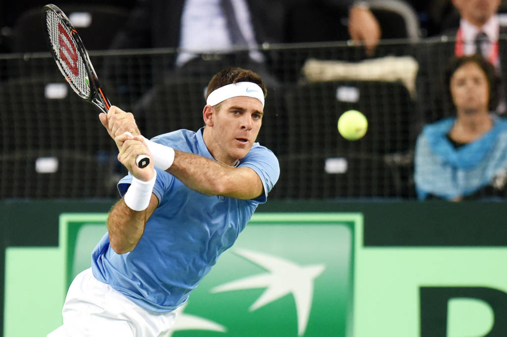 Argentina's tennis player Joan Martin del Potro returns the ball against Croatia's tennis player Ivo Karlovic during the Davis Cup World Group final singles match between Croatia and Argentina at the Arena hall in Zagreb, on November 25, 2016. / AFP PHOTO / STRINGER