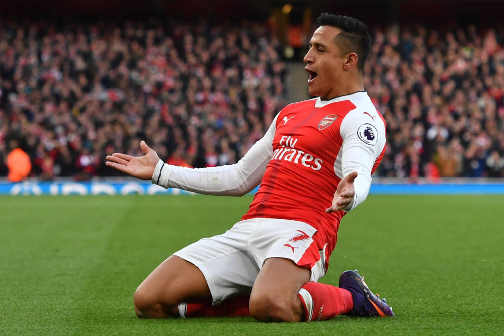 Arsenal's Chilean striker Alexis Sanchez celebrates after scoring the opening goal of the English Premier League football match between Arsenal and Bournemouth at the Emirates Stadium in London on November 27, 2016. / AFP PHOTO / Ben STANSALL / RESTRICTED TO EDITORIAL USE. No use with unauthorized audio, video, data, fixture lists, club/league logos or 'live' services. Online in-match use limited to 75 images, no video emulation. No use in betting, games or single club/league/player publications. /