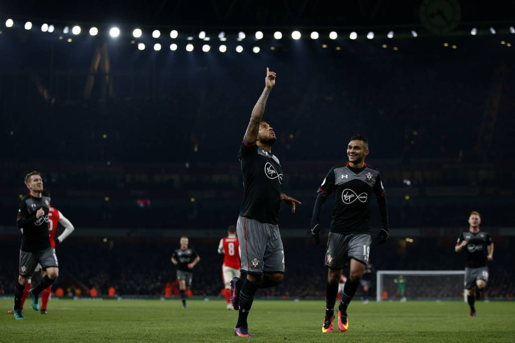 Southampton's English defender Ryan Bertrand (C) celebrates scoring his team's second goal during the EFL (English Football League) Cup quarter-final football match between Arsenal and Southampton at the Emirates Stadium in London on November 30, 2016. / AFP PHOTO / Adrian DENNIS / RESTRICTED TO EDITORIAL USE. No use with unauthorized audio, video, data, fixture lists, club/league logos or 'live' services. Online in-match use limited to 75 images, no video emulation. No use in betting, games or single club/league/player publications. /