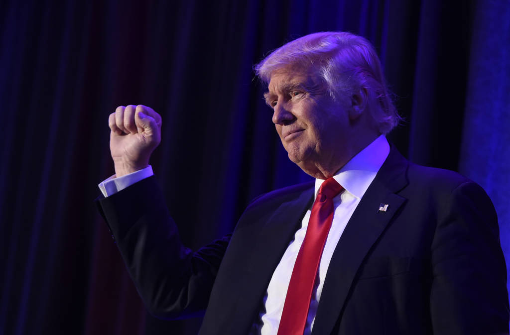 AFP PICTURES OF THE YEAR 2016 US President-elect Donald Trump arrives at the New York Hilton Midtown in New York on November 8, 2016. Trump stunned America and the world Wednesday, riding a wave of populist resentment to defeat Hillary Clinton in the race to become the 45th president of the United States. / AFP PHOTO / SAUL LOEB